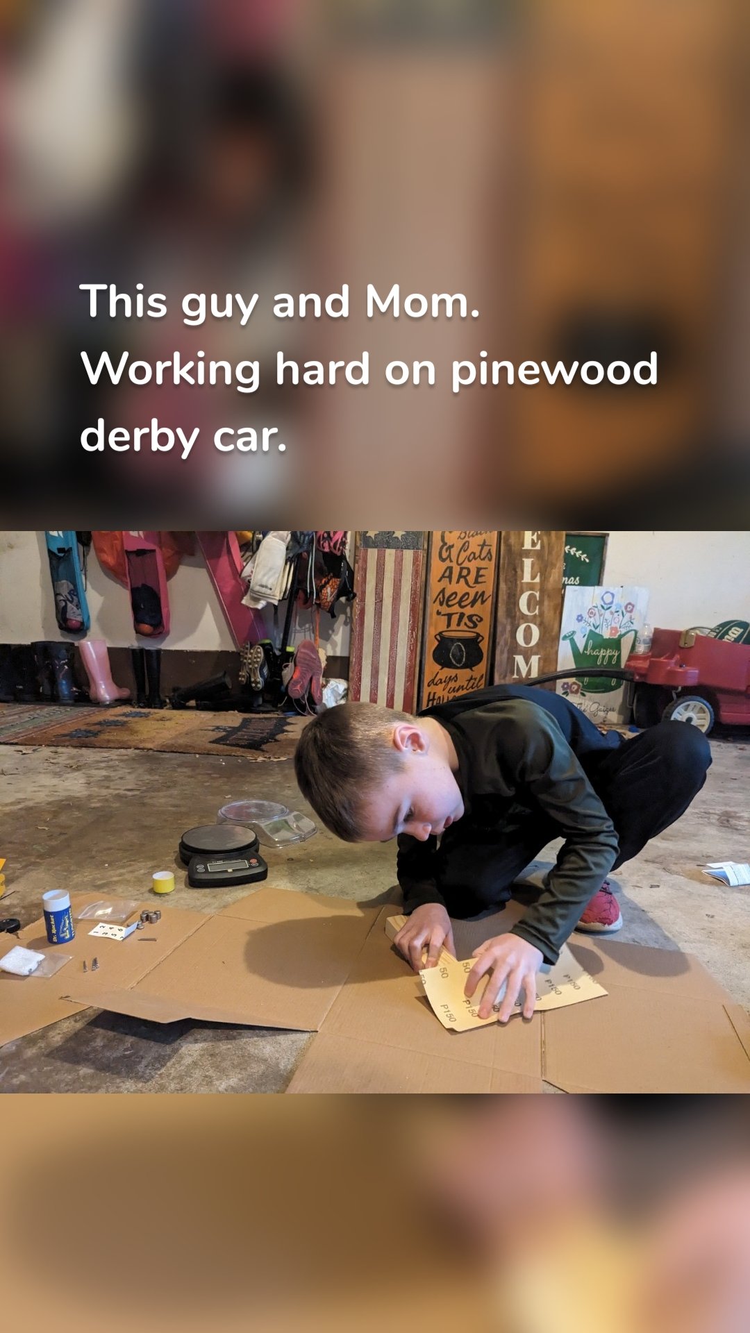 This guy and Mom. Working hard on pinewood derby car.